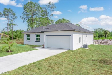 View of front of home featuring stucco siding, a g