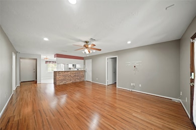This photo showcases a spacious open-concept livin