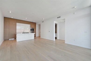 Unfurnished living room featuring light wood-styl