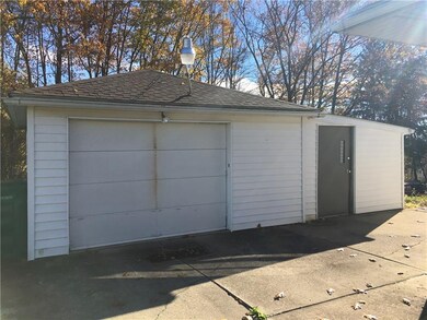 One car detached garage with side shop/shed