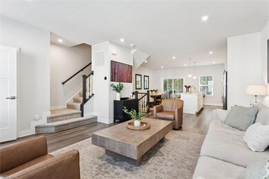 view from living room to kitchen and dining area