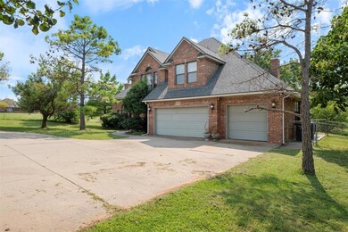 View of front facade with a garage and a front yar