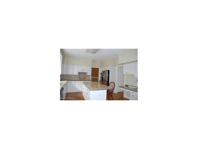Kitchen with hardwood flooring, stainless steel ap