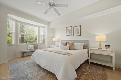 Bedroom featuring light wood finished floors and a ceiling fan