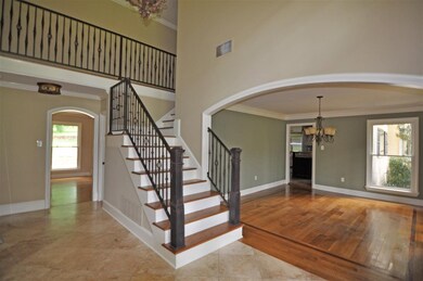 A stunning 2-story grand foyer, accented with eleg