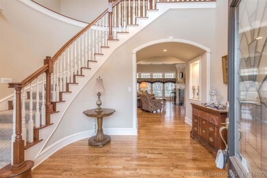 Impressive 2-story entry with curved staircase, hi