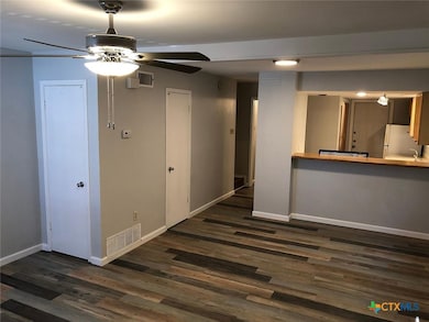 Living room looking into kitchen