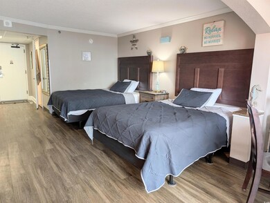 Bedroom featuring ornamental molding and wood-type