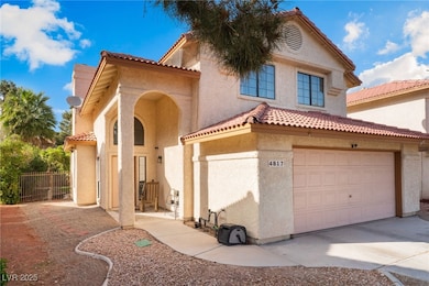 Mediterranean / spanish-style home featuring stucco siding, a tiled roof, concrete driveway, and a garage