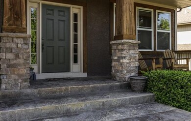 Relaxing front porch, stacked stone pillars