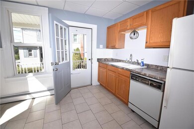 Kitchen with access to side covered porch