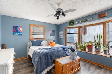 Master bedroom with bay window letting in plenty of natural light.
