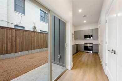 Kitchen featuring light wood-type flooring, gray c