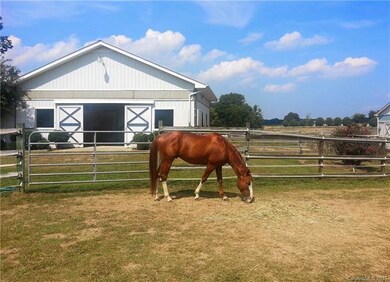 Large Barn with sliding doors, four 12x12 stalls, 