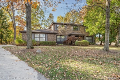 Traditional-style brick colonIal  with covered front porch