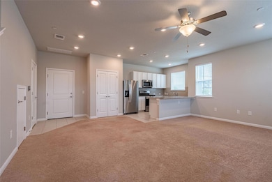 Kitchen with stainless steel appliances, light co