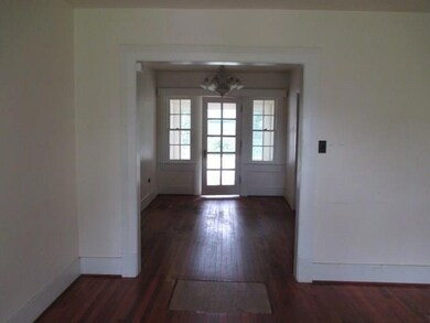 view from living room to dining area and laundry r