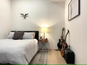 Bedroom with wood finished floors