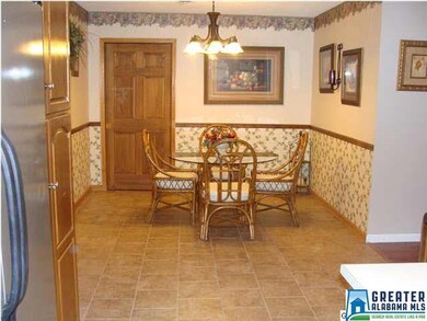 standing in the kitchen looking into the dining ar