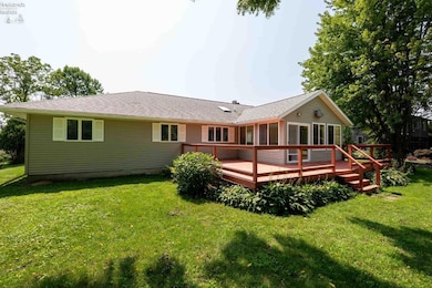 Back view, large back yard wood deck and back entrance into the sun room.