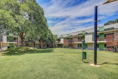 View of home's community featuring a lawn and a r