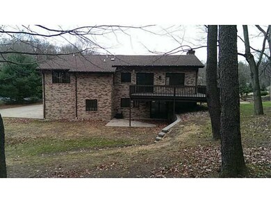 Exterior Back. Privacy with woods in back of lot.