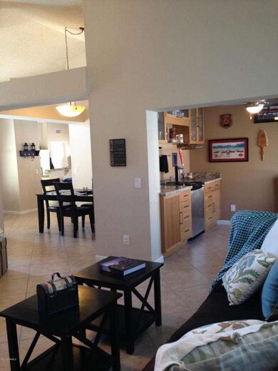 Living Room looking into Bar & Dining Rm