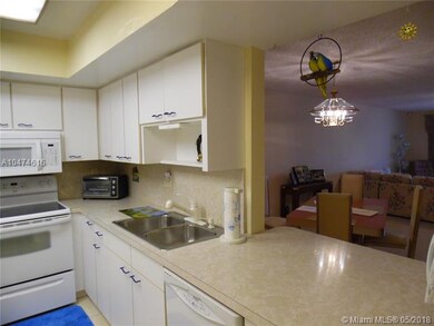 Kitchen opens up to living / dining area