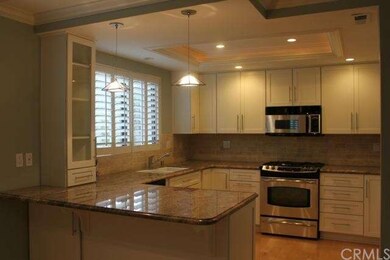 Angle of kitchen to view Plantation Shutters and G