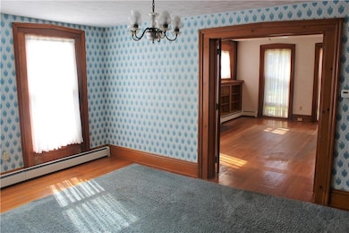 Formal dining room with wood floors