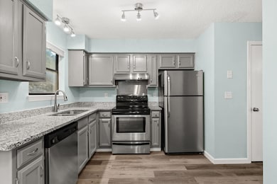 Kitchen featuring appliances with stainless steel