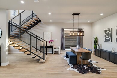 Dining space with a notable chandelier and light h