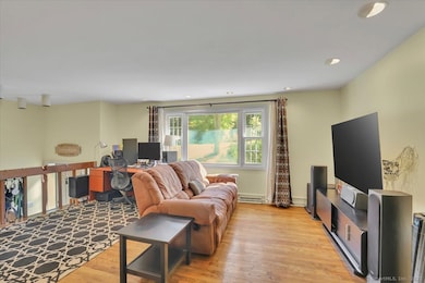 Large open floor plan featuring bright family room with HW floors