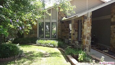 Closer view of front entry with awesome landscapin