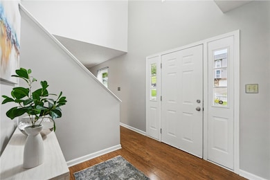 WELCOMING FOYER WITH NEUTRAL PAINT
