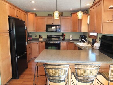 Beautifully remodeled kitchen with breakfast bar.