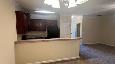 Kitchen featuring beautiful cabinetry, refrigerato