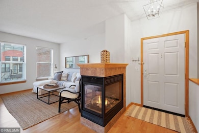 Three sided gas fireplace greets you in the entryw