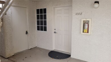 View of exterior entry featuring stucco siding