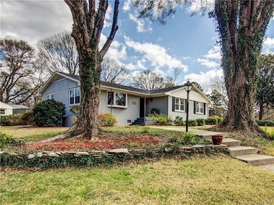 Ranch Home side view solid brick home with 4 bedro