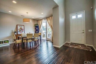Warm and inviting distressed hardwood flooring are