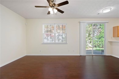 Empty room featuring visible vents, baseboards, da