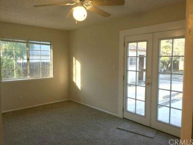 Master bedroom with ceiling fan and French doors t