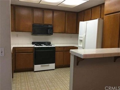Kitchen Features Gas Stove and Microwave