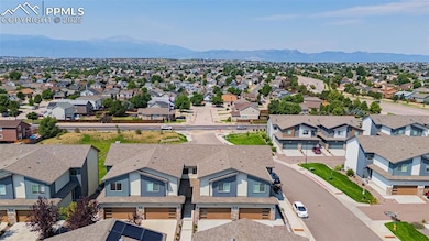 Aerial view of residential area featuring a mountain backdrop