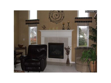 Great room with lovely fireplace, neutral carpet a