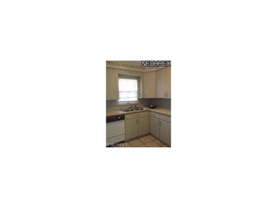 Updated kitchen with ceramic tile flooring