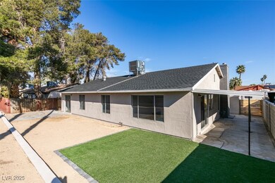 Back of house featuring stucco siding, a fenced ba
