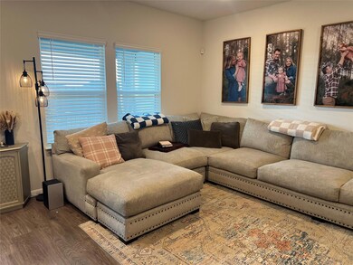 Living area with wood finished floors and plenty 
