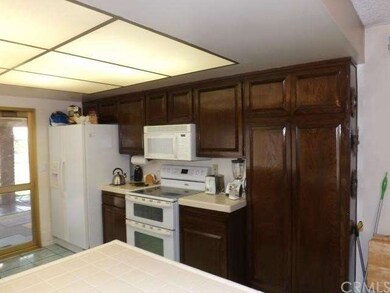 Kitchen with double oven, pantry and microwave